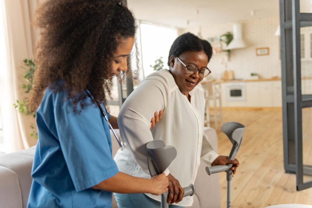 Health and Social Care (Triple) WJEC Diploma - Student helping elder