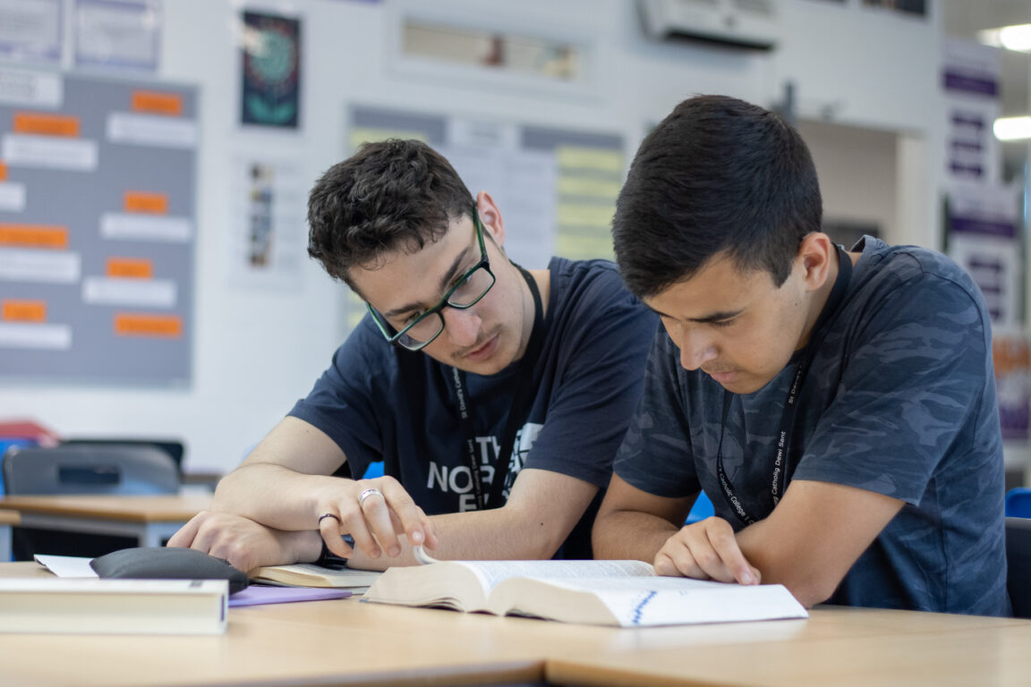 Students reading a book - example of St David's College programmes