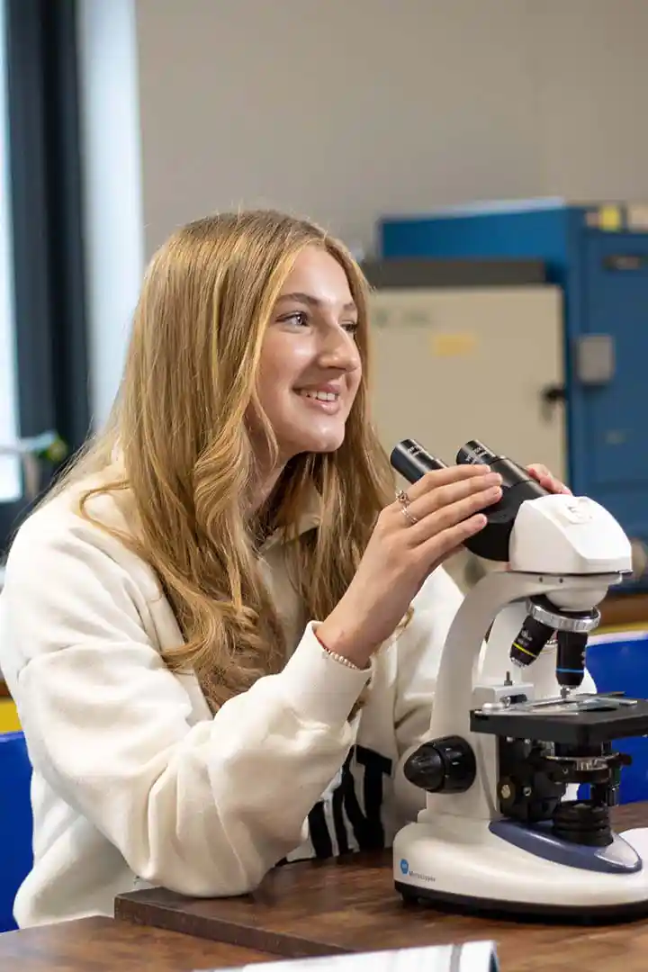 Home of St David's College - Student using microscope in Science lesson