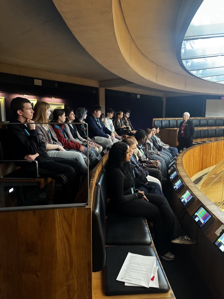 Students watching from the Senedd viewing gallary.