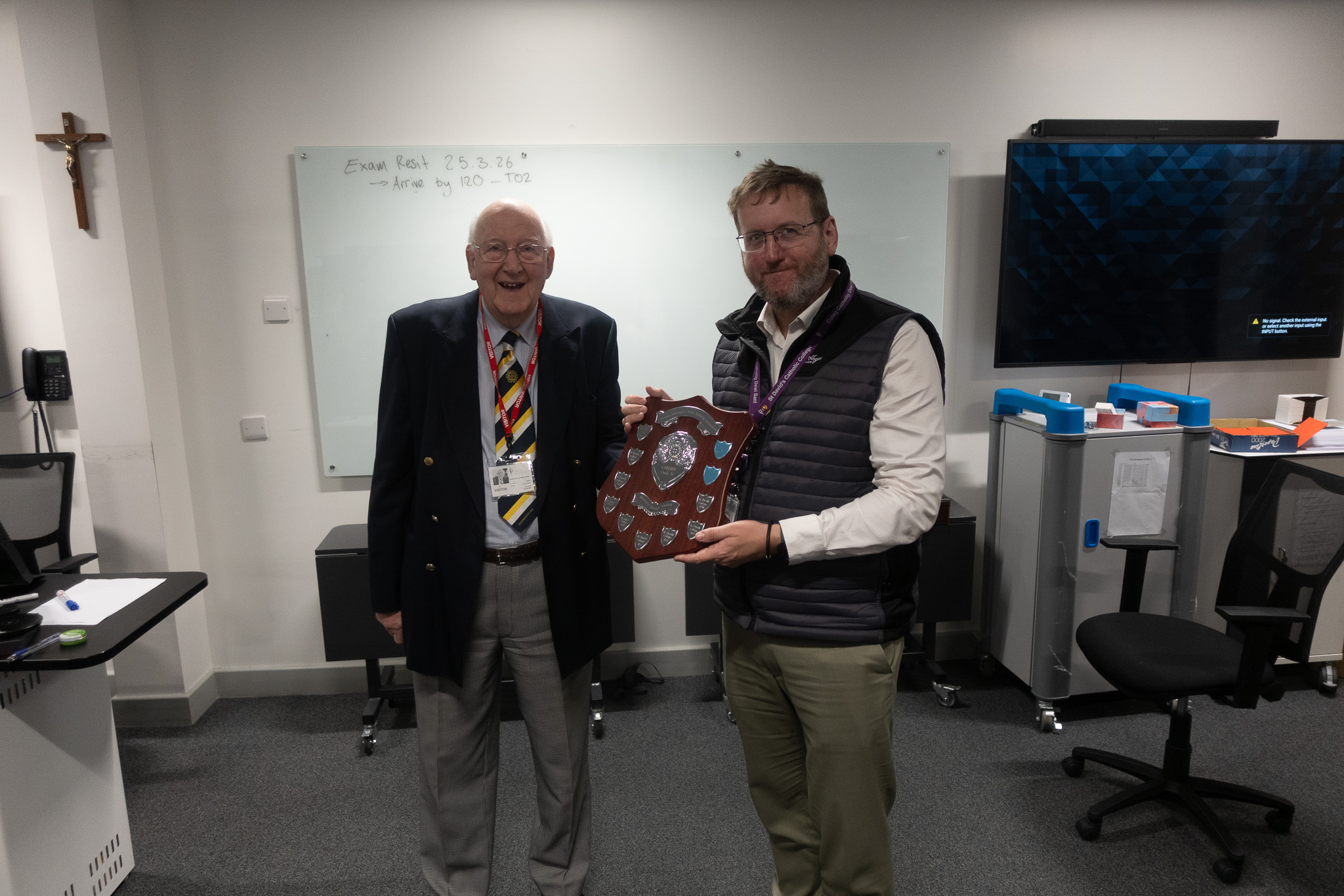 teacher holding prize