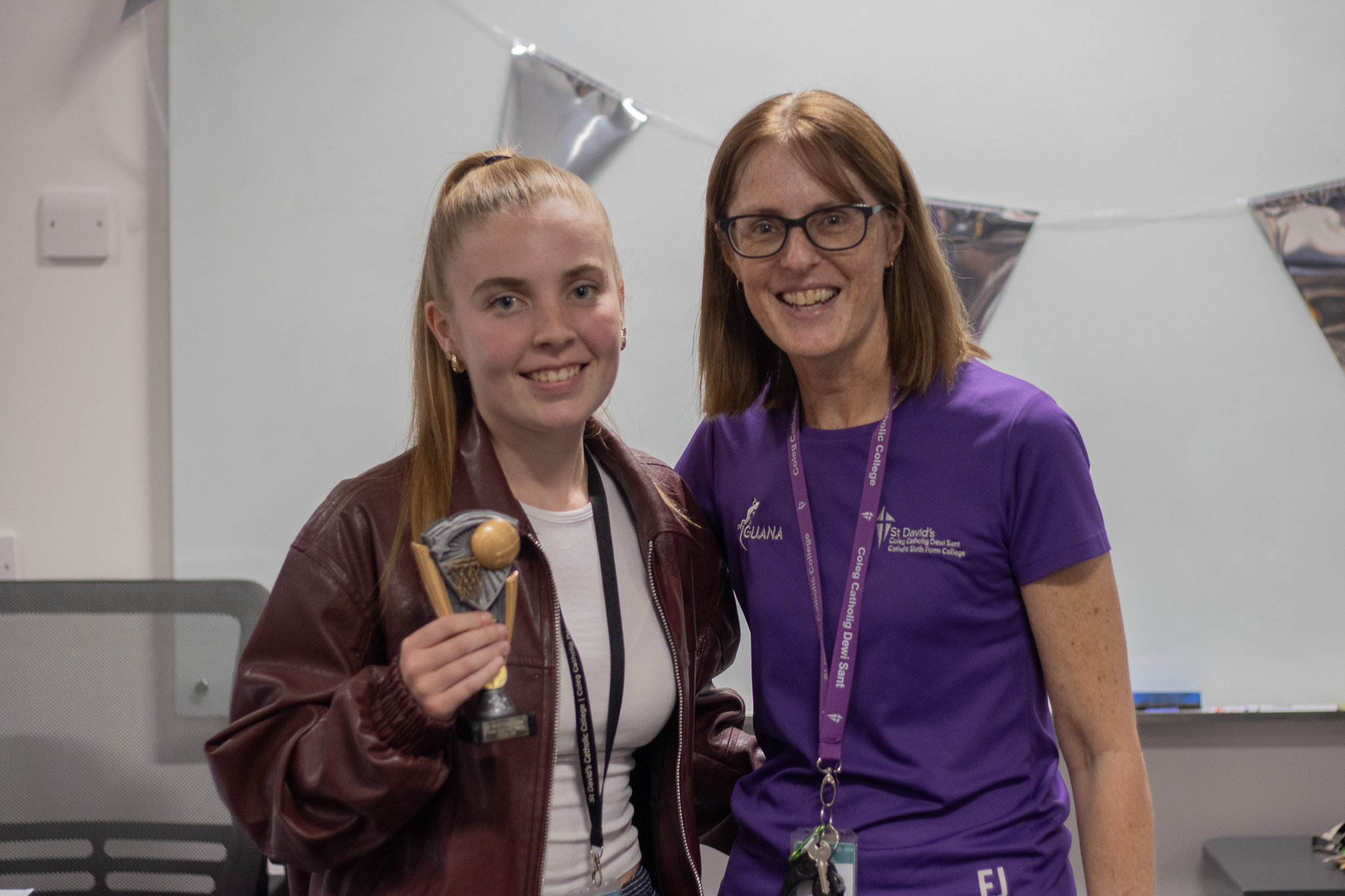 St David's Netball player holding award