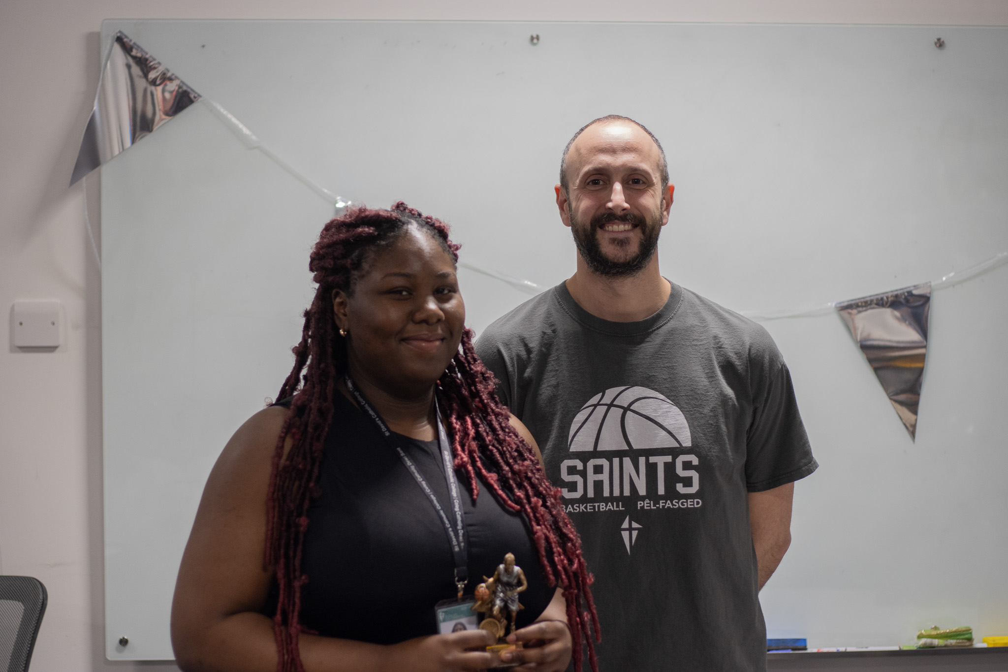 Member of the St David's Girls Basketball team winning an award.