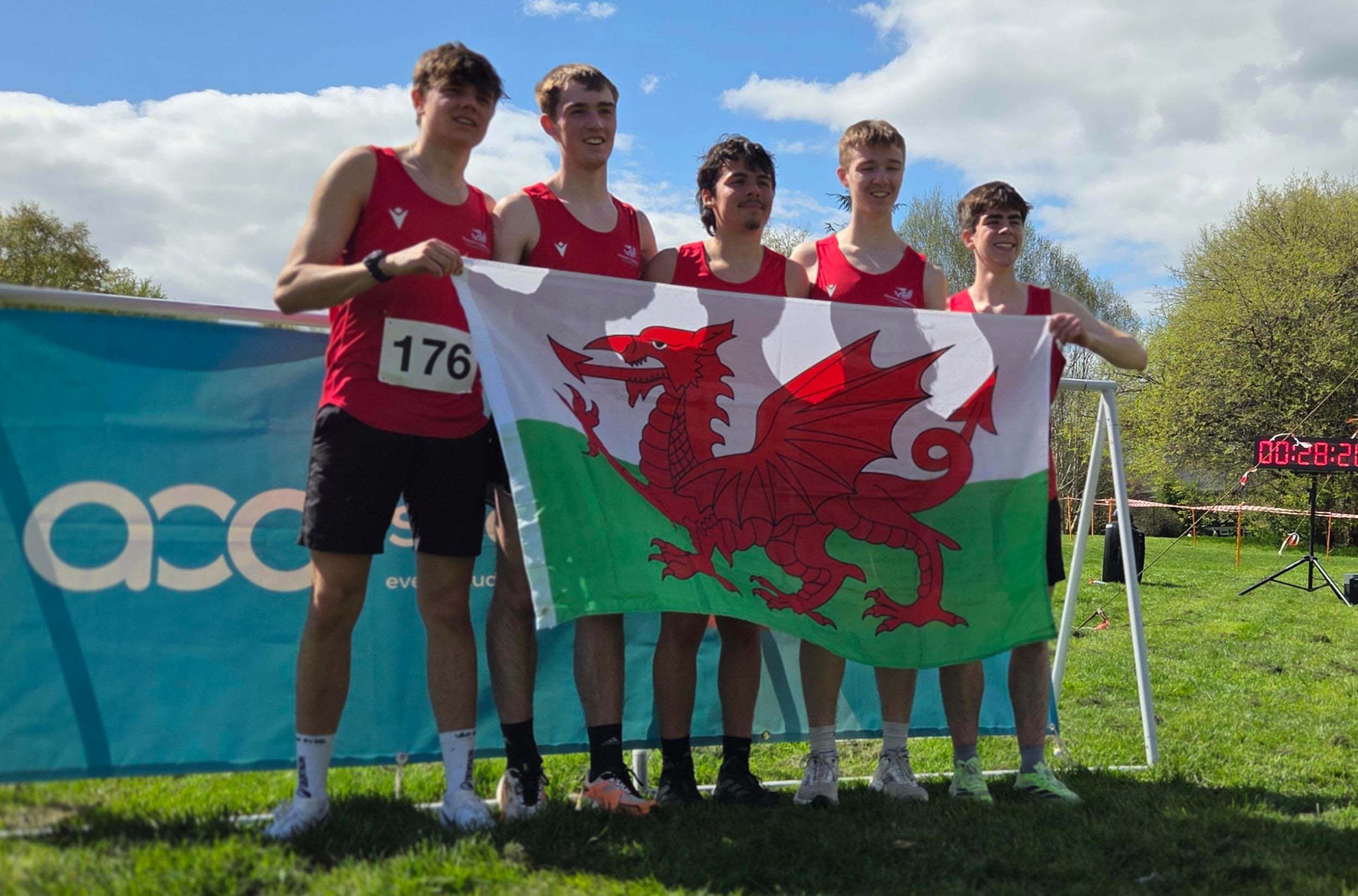 Cross Country runners with Welsh flag 