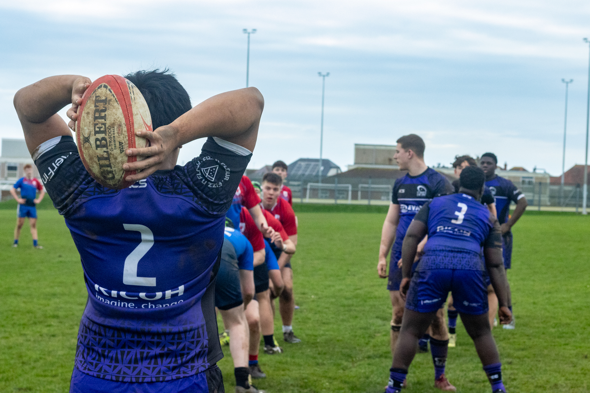 rugby player about to launch ball at line out