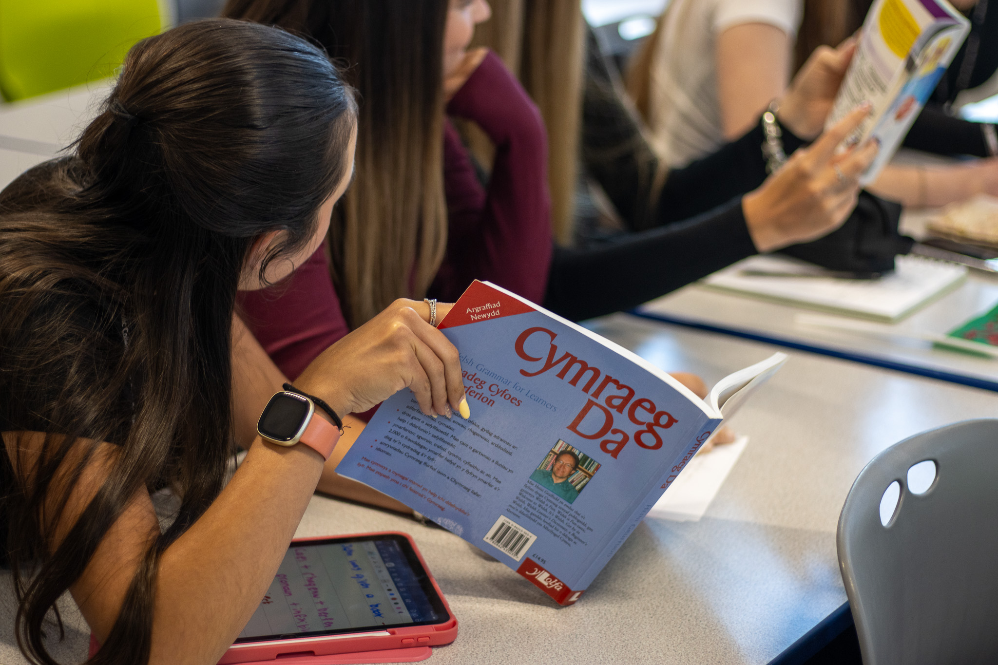 Student with a Welsh textbook