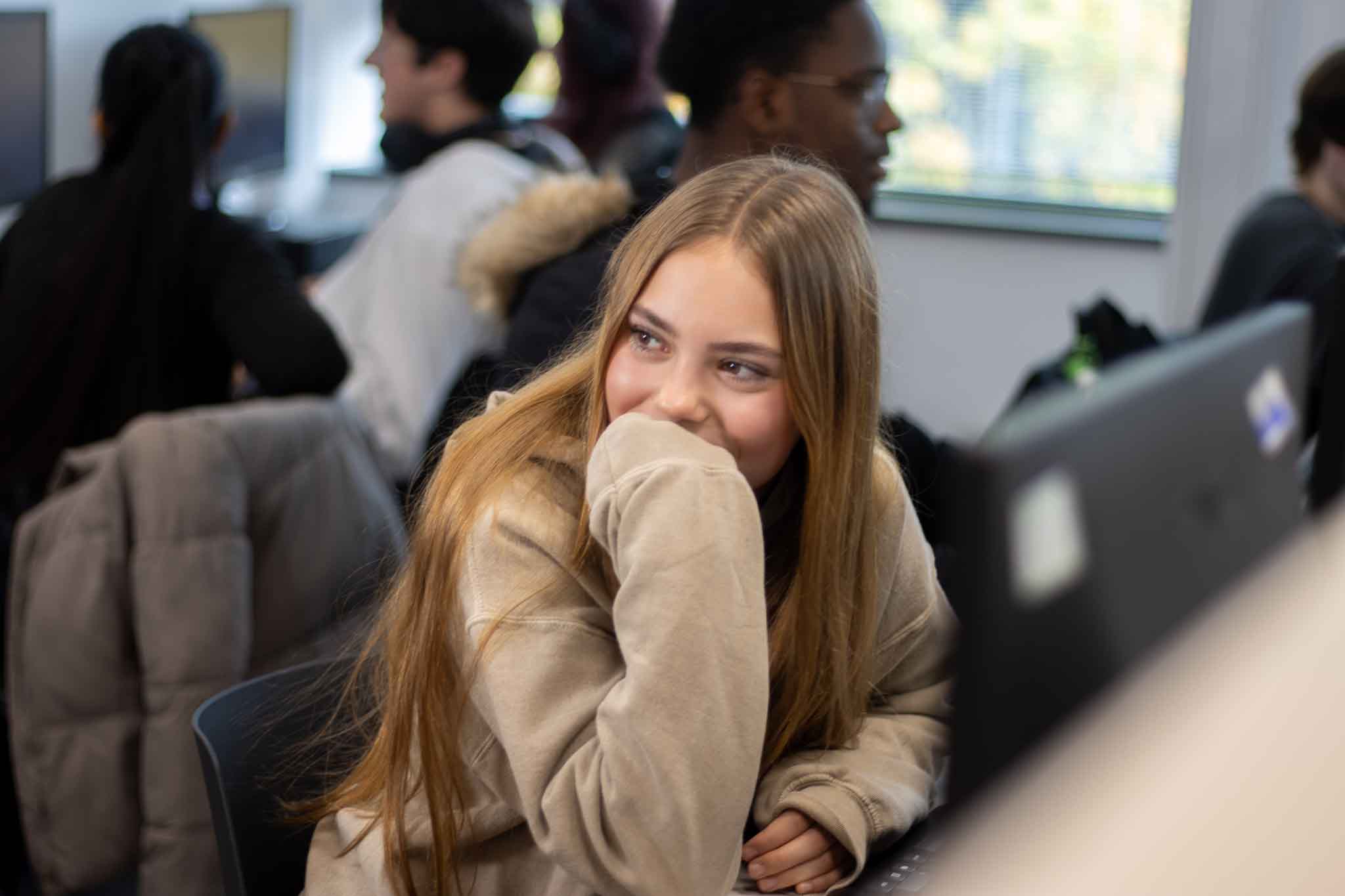 Student at St David's College sat in IT lesson looking for college information