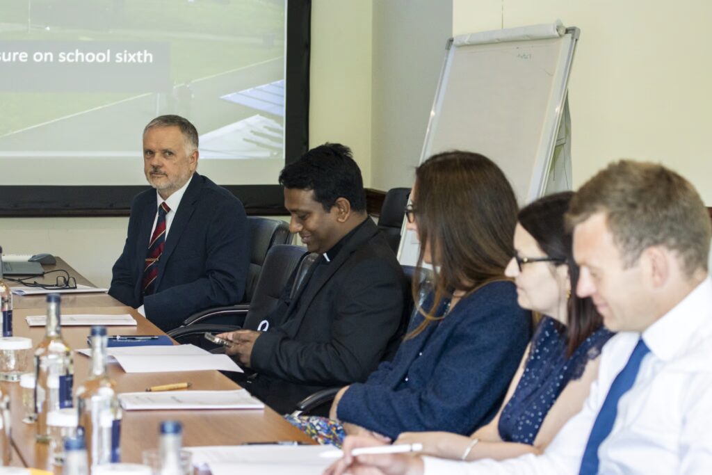 Delegates seated around table at the St David's Symposium For Innovation in Catholic Education