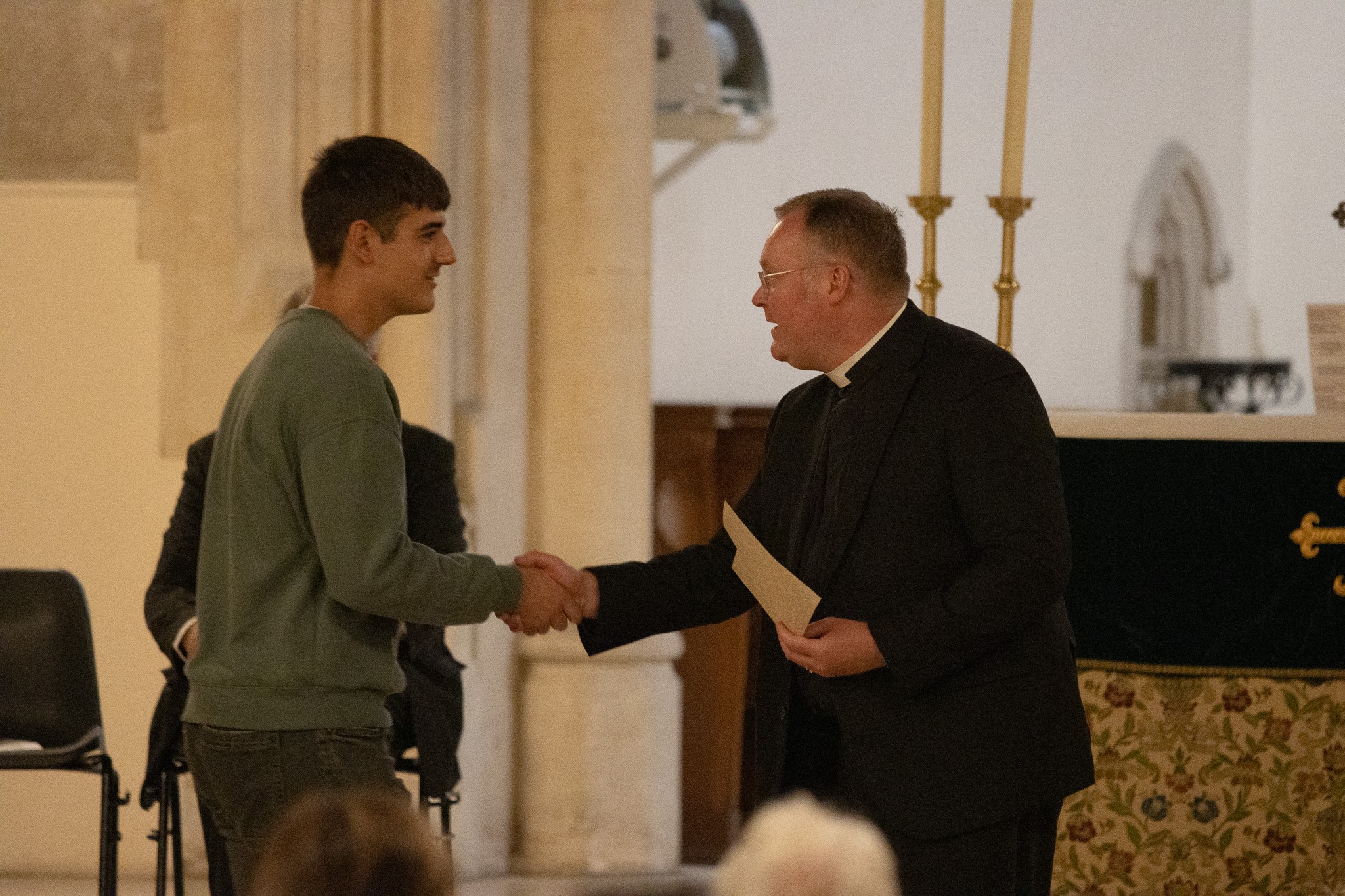 St David's Class of 2026 student shaking hands and getting an award.