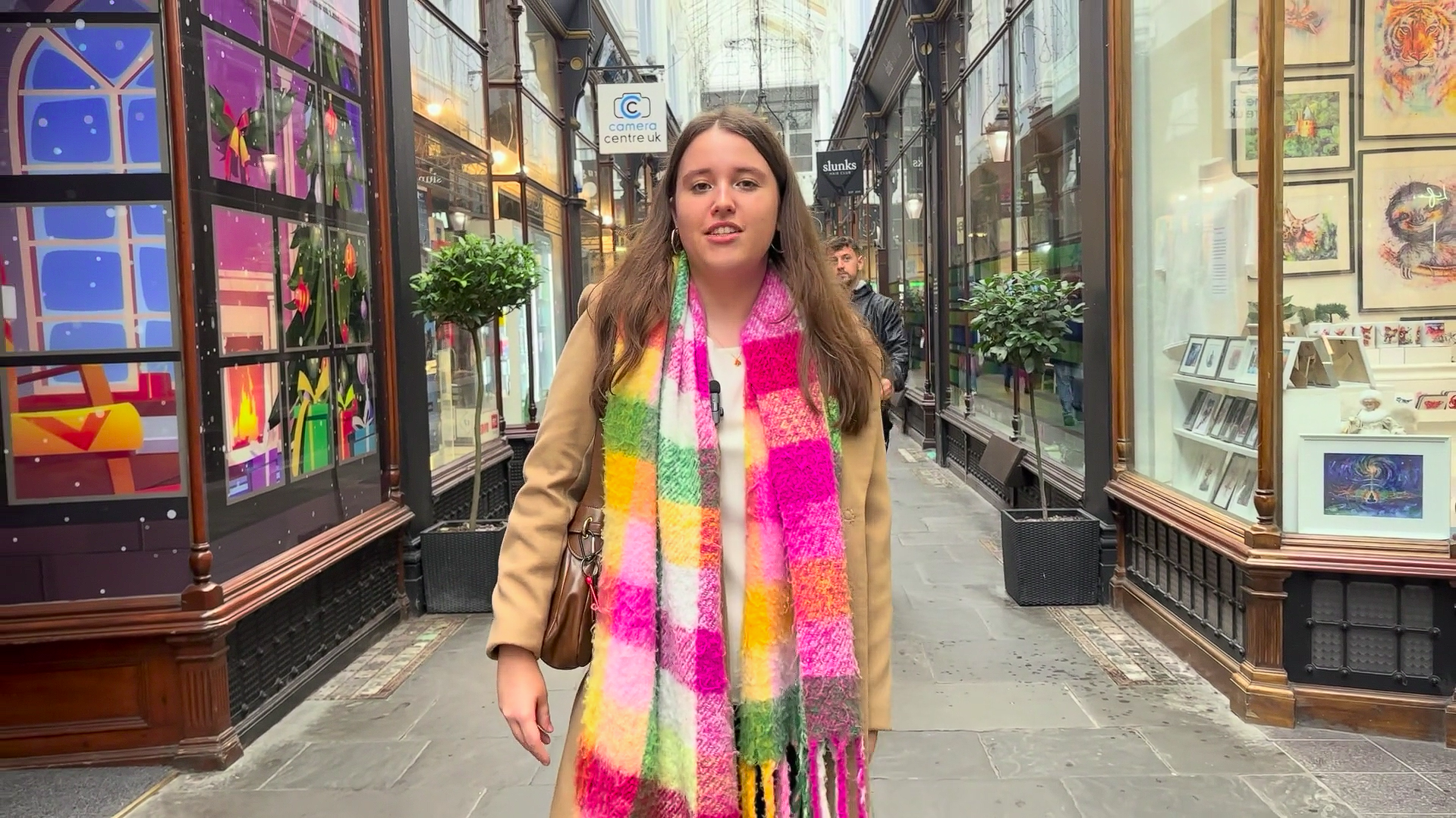 Former St David's College student walking towards camera in Cardiff arcade