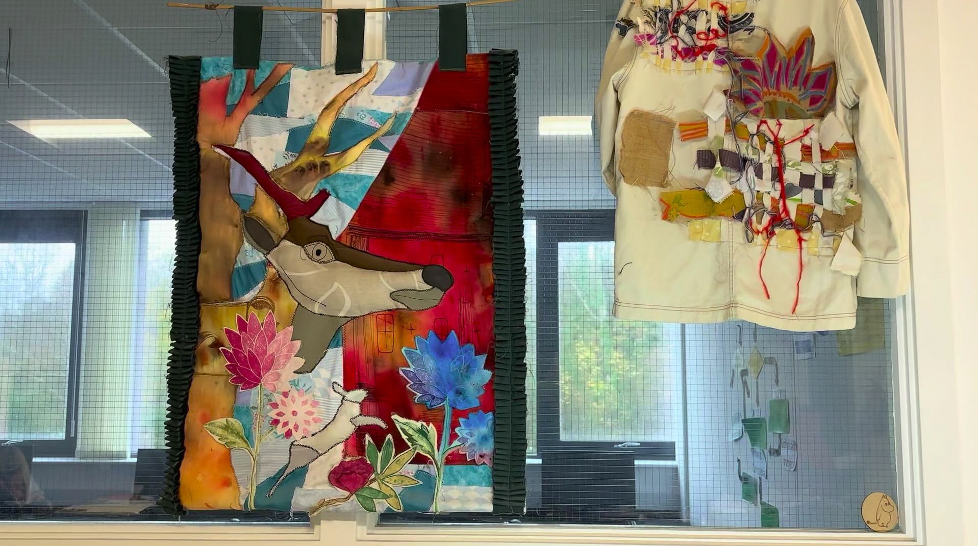 tote bag and art hanging in classroom