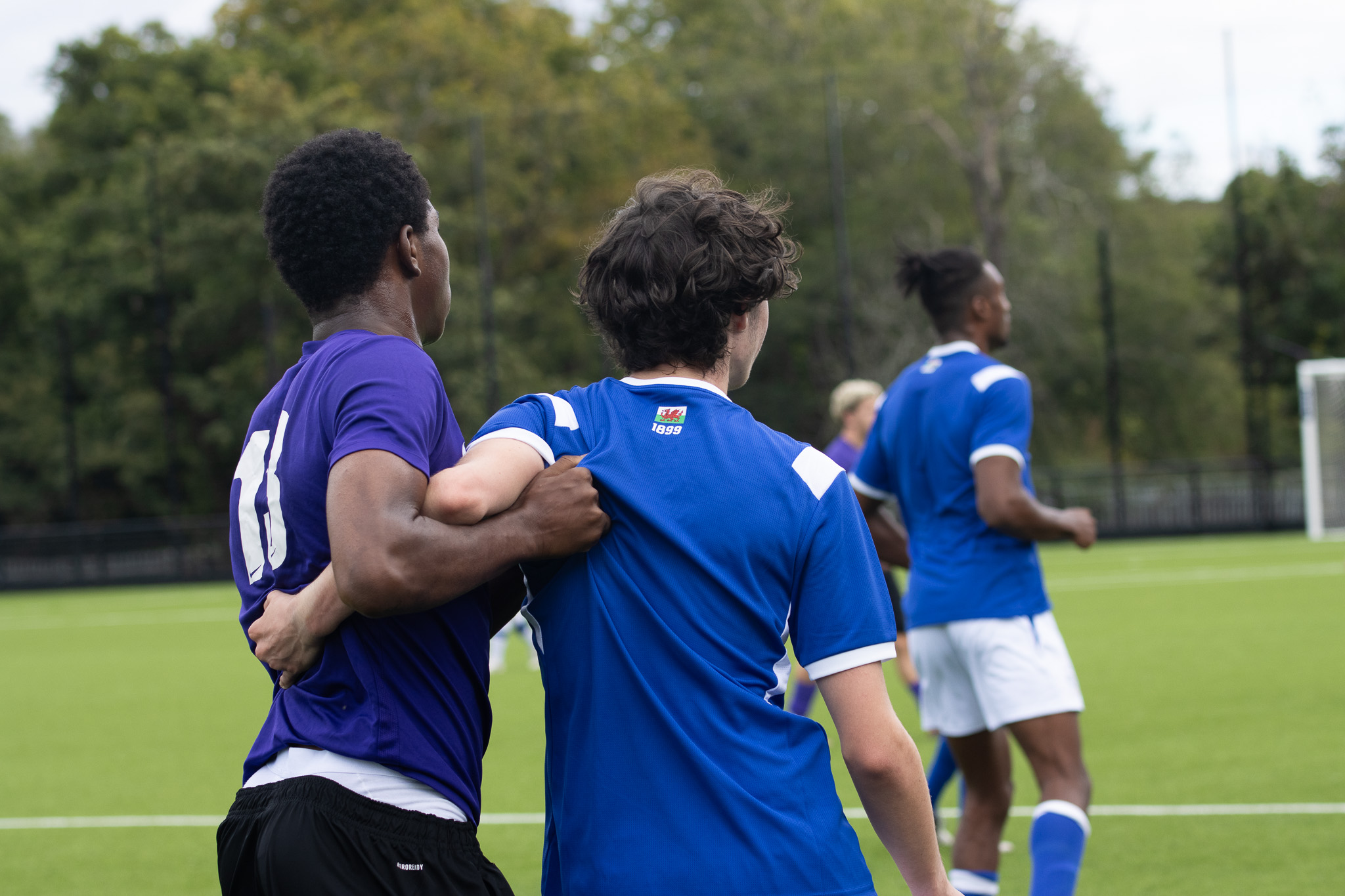 St David's College football player jostling with an opponent