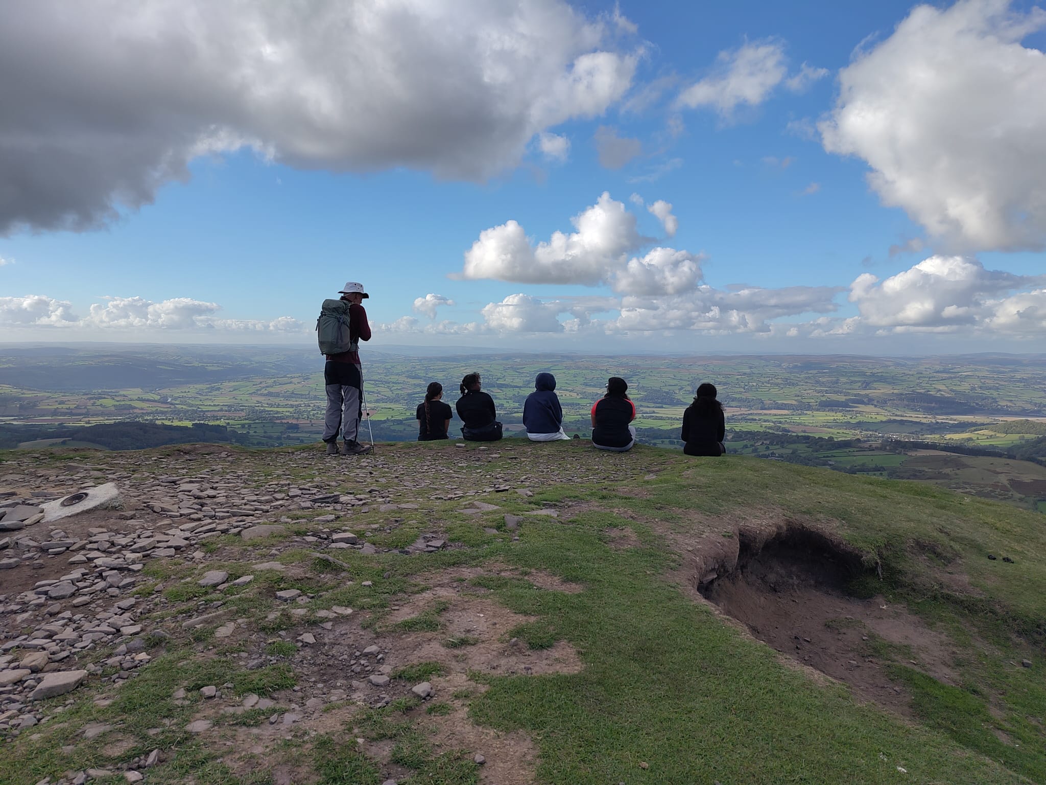 St David's College students looking away on top of St David's College students posing on Brecon Beacons
